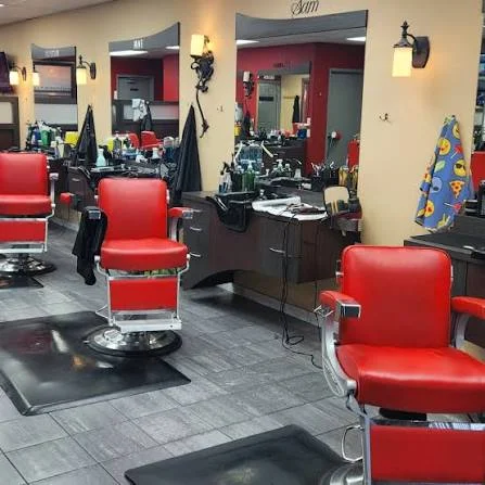Red barber chairs and mirrors at Empire Barber Shop